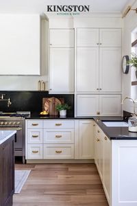 The dark tones against the primarily white design mixed with the brass fixtures all complement each other so well. Photo credit: @colucci_design_co English Country Bridge Kitchen Faucet: #KS7792ALBS