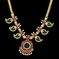 One Gram Gold Plated Traditional Mango Necklace is Simple and ethnic South Indian, Kerala Jewelry. This Jewelry has been arranged beautifully with Mango enamel motifs and ruby stones. This have small round pendant with Golden bead hangings. Length can be adjusted with backlink chain. It is best suited on festive occasions, Marriages and as Bridal wear and dancewear.