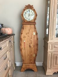 "Elizabeth, grandmother clock. This clock is a truly unique item. The top and the middle section open. It has shelves inside. She comes in special walnut, pecan or time worn white. It is shown in pecan. She has a lock and key. She is made in three pieces and is shipped in two boxes and will need to be bolted together.Bolts are included. Hand carved, hand made, unique item. Not sold in stores. Makes a nice family heirloom. It is also available with an hourly charm. Choose special walnut, pecan as