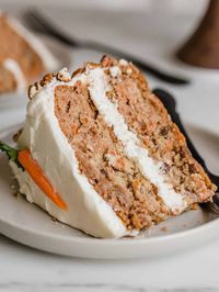 This is my family's favorite carrot cake recipe. It's easy to make from scratch, super moist and so delicious! This carrot cake is loaded with cinnamon and covered in a homemade cream cheese frosting. This is truly the best carrot cake you’ll ever eat!