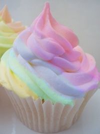 vanilla cupcake with pastel colored frosting