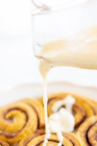 Easy 4 ingredient, 5 minute luxuriously creamy cream cheese icing for cinnamon rolls to take your rolls, breads and baked goods to the next level!