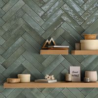 Showcasing vibrant green coloring, the Home Brick Forest porcelain wall tile will awaken any space with a refreshing sense of nature. This glossy 2" x 10" tile features a subtle brick appearance with high color variation from piece to piece for a more artisanal style. With a uniquely slim subway tile shape, it also offers added depth and dimension. Coordinate this tile with the matching Home Kit-Kat Forest porcelain wall tile to create a custom design. | Home Brick Forest Tile - 2 x 10 in | Wall