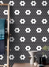 This Blossom Hex Black w/ White 1-Inch Flower Mosaic Tile will add a classic and timeless look to your home. Featuring a 1" hexagon shape and a beautiful flower pattern in black and white, this quality tile will make a striking statement in any room. Size: 10"x12"Thickness: 5 mm ( 0.2 inches )Material: PorcelainFinish: SatinShape: 1 inch HexagonUse: Floor and WallResidential and Commercial UseMade In IndiaPEI - 2V1 VariationEasy to cleanPieces Per Case: 20Square Feet per Case: 16.21 piece is equ