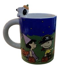 This Peanuts Halloween Snoopy Mug is the perfect addition to any fan's collection. Featuring Snoopy, Woodstock, Charlie Brown, Linus, Sally, and Lucy, this ceramic coffee mug has a colorful multicolor design. The mug is made in China and is perfect for celebrating Halloween with your favorite Peanuts characters. Condition is Brand New. Comes from a Smoke Free Home. PayPal Only. Shipped in United States Only Via USPS, FedEx or UPS (whichever is more cost effective).