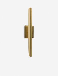 Our lovely golden Baton Sconce is a calming, simplistic addition for a mid-century inspired space. A gentle touch for any hallway or room.