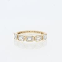 14 karat yellow gold east west emerald diamodns bezel set in stacking fashion wedding band W08174