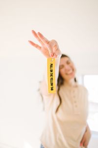 Hands up and pull on the yellow tab! For park lovers everywhere that want to be in on the joke🙌🏻 Embroidered keychain with an adjustable ring