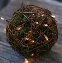 Our Large Grapevine Topiary Ball is a handcrafted natural grapevine sphere proudly made in the USA. Use to make a topiary or a decorative flower ball. Put this giant grapevine ball on a pedestal and fill the inside with fairy lights for a spectacular event display. This rugged orb of twisted and woven twigs and tendrils over chicken wire is an essential accent to rustic displays. Approximately 16 inches in diameter. Note: This item is natural grapevine that is formed by hand. Each will vary in s