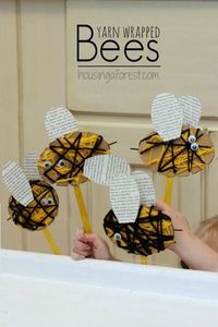 Yarn Wrapped Bee Puppet ~ using cardboard, black and yellow yarn, goggly eyes, glue, popsicle stick, and old book.