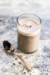 This black sesame latte is paleo, vegan, and Whole30-compliant, and it is so delicious and perfect for Halloween! It has the most addicting flavor. #paleo #vegan #latte #paleodrink #whole30 #halloweenrecipe #realfood #dairyfree #glutenfree #refinedsugarfree