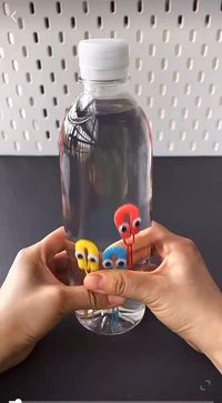 A fun submarine sensory bottle that children can help create then play with or use as a calm down jar (using easy to find materials in any country).