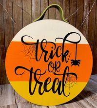 Trick or Treat! This cute little wood sign is perfect to add to your Halloween décor this year! It is so versatile because of its size. You can hang it by the olive green color leather strap at the top or it is thick enough that it will stand on its own! Would be perfect addition to put next to other décor or super cute all by itself.  The colors are painted to look like a candy corn candy; white, orange & yellow with the sides and back done in black and the vinyl lettering done in a black.