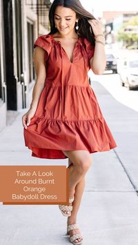 Just take a look around. You won't find a better fall transition dress! This cutie is perfect! The color is just what you are looking for in the fall months the fit and fabric are just what you need when it's still a bit too warm to go full fall! This dress features short cap sleeves, a v-neck with ties, and a tiered fit.