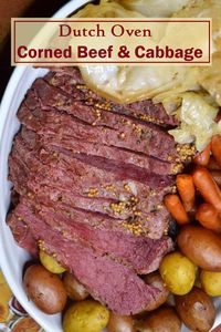 Dutch oven corn beef and cabbage is perfect for celebrating St. Patrick's Day or serving for Sunday dinner. Slow cooked Dutch oven corned beef is a classic family meal that's loaded with meat, potatoes and vegetables. Warm and comforting, this meal will make your house smell amazing and only takes about 10 minutes to prep. Cooking corned beef low and slow in a Dutch oven makes the meat fork-tender and the cabbage melts in your mouth. Click to get the Dutch oven corn beef and cabbage recipe.