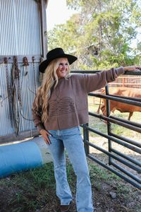 Get ready to embrace some western vibes with our Western Wonders Brown Stitch Sweater. Made with high-quality stitching and soft fabric, this sweater will keep you warm and stylish. Perfect for pairing with your favorite jeans and boots, this sweater is the perfect addition to your wardrobe. Yeehaw! Model wearing L/XL.