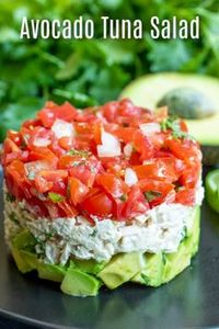 This healthy Avocado Tuna Salad recipe is a keto and low carb lunch or dinner recipe made with creamy tuna and mayonnaise, cilantro, tomatoes, and fresh avocado. It's one of my favorite avocado recipes! Make this simple avocado tuna salad for lunch or dinner this week. #tuna #avocado #ketodiet #keto #lowcarbrecipes #lowcarb #homemadeinterest