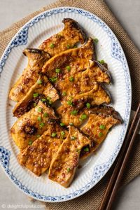 These Grilled King Oyster Mushrooms with Sate Sauce are flavorful and easy to make. The recipe is vegan and gluten-free adaptable.