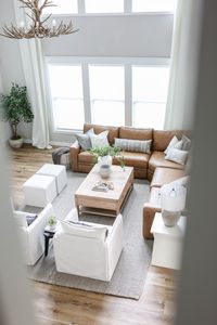 Love the leather sectional with the linen accent chairs!