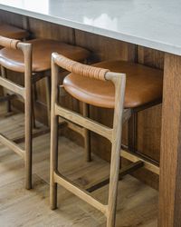 Our Bodhi Counter + Bar Stool epitomizes contemporary design with its minimalist frame and sleek profile. Crafted with a top-grain leather seat and a low back featuring leather wrap detailing, it exudes both style and comfort. Each piece showcases the natural richness and unique characteristics of top-grain leather, adding a touch of luxury to any counter or bar area.Dimensions: 19.00"w x 20.00"d x 30.50"h Ships in 4-5 weeksTHIS ITEM IS FINAL SALE. NOT AVAILABLE FOR IN STORE PICKUP.*White Glove