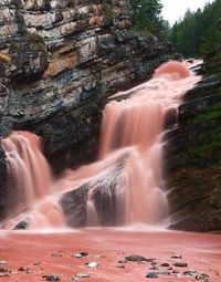 Pink waterfall | After heavy rainfall at Cameron Falls in Canada, agolite, a red-coloured sediment, causes the water to turn red.