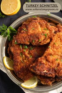 Learn how to make crispy turkey schnitzels with a golden coating using simple ingredients like turkey breast, breadcrumbs, and Parmesan. Serve them hot or use them to make sandwiches or burgers.