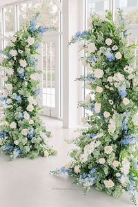 The Camille Floral Pillars were designed with a timeless French vineyard style, using ivory garden roses, white playa blanca roses, white delphinium, dusty blue delphinium, ivory veronica, white ranunculus, white anemone, ivory rose buds, with seeded eucalyptus, and sage spiral eucalyptus. They are absolutely breathtak