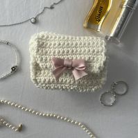 the cutest pouch to fit all your necessities in or the perfect gift for anyone! 100% handmade with love from my room to yours <3 info - made with cotton yarn (wont get bobbles and more durable) - can be customised in your own colours  - comes with freebees :) - 1.5 hours to make <3 - feel free to dm me on etsy or instagram if you would like to change anything or have specific colours that arent listed colour options info - primary colours specify the colour of the yarn being used to make the yar