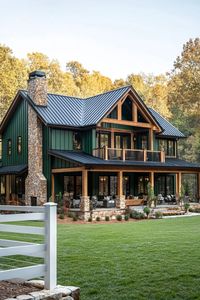 Wide view of a large modern farmhouse exterior with forest green siding and black metal multi pitched roof natural wood beams stone chimney a big. Check out all of these dream farmhouses that will have you drooling with rural living fantasies and mooing with joy!