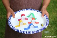 In this STEM challenge for kids, children will create a paper plate marble maze game inspired by pinball machines using just a few common craft supplies and a marble. Follow our STEM for Kids Pinterest board!   In our most recent science club, I challenged my students to create a pinball-like marble maze game using a paper …