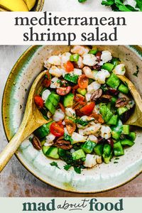 This Mediterranean Shrimp Salad is a fresh twist on the traditional shrimp salad. It is a simple and delicious lunch option made with lots of veggies and a Greek vinaigrette.