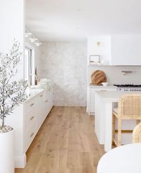 Batty’s Bay Build on Instagram: "Can we just take a moment to appreciate how devine this kitchen from @andyanddeb @dnaofdesign_ is! 😍 The texture of the stone wall combined with the neutral palette 🤌🏼 . . . . . . . . . . . #kitchen #kitchendesign #kitchendecor #kitcheninspiration #stonewall #neutralstyle #neutralpalette #woodfloors #dreamhome #interiordesign #interior #design #home #lightandbright #buildandrenocommunity #whitekitchen #shakercabinets"