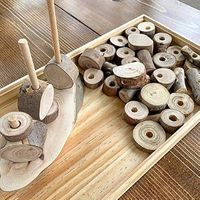 Wood cookies are a great loose part to use as fine motor development, math, or small world play