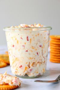 Pimento Cheese Spread Recipe made with chopped pimento peppers, shredded cheddar cheese, cream cheese and mayo. Quick and easy as cracker topping or sandwich filling for your next party! #appetizer #partyfood #cheesedip