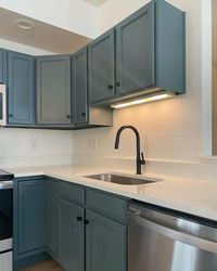 Muted blue kitchen cabinets paint