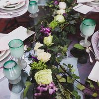 White roses and purple alstroemeria on green ivy as a wedding flower garland