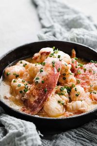 This delicious poached butter lobster recipe is cooked in white wine and butter for a fantastic mouthwatering seafood dish.