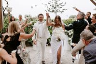 Ceremony under the grapevine on a rainy day at Fig Tree Restaurant Byron Bay