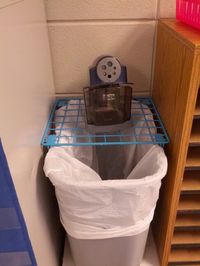 Tired of my pencil sharpener making a mess on the shelf. So I fixed it! Walmart metal locker shelf on top of a trash can. The grate in the locker shelf let's the mess fall straight into the trash can!