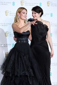 Gemma Arterton Photos - (L-R) Presenters Lily James and Gemma Arterton pose in the press room during the EE British Academy Film Awards (BAFTA) held at Royal Albert Hall on February 18, 2018 in London, England. - EE British Academy Film Awards - Press Room