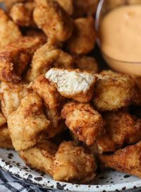 Homemade Chicken Nuggets are flavor packed and delicious. Just like Chick Fil A, with juicy chicken and a crispy coating. You can fry or bake these! #cookiesandcups #chickennuggets #homemadechickennuggets #chickfila #chickfilacopycat #chickenrecipe #friedchicken