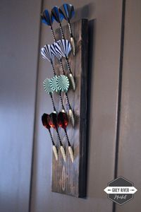 "Keep your darts organized, neat, and tidy with this simple Scandinavian design wall-mounted dart holder! *Profile Photos Shown: Carbon Grey and Rustic Walnut SIZE: The holder is 16\" x 5.5\" x 0.75\". HOLES: Choose 12 or 15 holes. (Shown are holders with four rows of 3 holes for 12 darts.) Each pocket hole is deep enough - and with a hole in the center - so the tip/point of each dart fits snugly without breaking off. HANGING HOLDER: There are two metal hardware hangers mounted on the back to ha