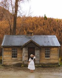 Autumn log cabin in the woods with Bo-peep wearing Harvey Amber straw hat.