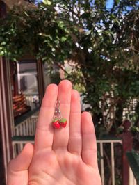 the sweetest little strawberry earrings handmade by me from polymer clay and stainless steel earring hooks, perfect for everything! they are light weight and decently durable though not water proof.   check my shop for details about postage :)