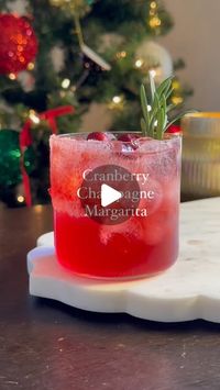 Danica Frye on Instagram: "This is THE margarita for the holidays ❤️

I always looove a Champagne Margarita for celebrations, so I thought we should have a holiday version! You’re going to love this one — recipes for a single serve and a batch are below!

Comment GLASS and I’ll dm you the link to everything I used here.

INGREDIENTS, for 1:
2 oz tequila
1.5 oz cranberry juice
3/4 oz orange liqueur
1/2 oz lime juice
1/2 oz agave
Champagne to top

INGREDIENTS, for 8:
2 cups tequila
1.5 cups cranberry juice
3/4 cup orange liqueur
1/2 cup lime juice
1/2 cup agave
1 bottle champagne 

METHOD:
Start by brushing the side of your glass with agave, then roll it onto a plate covered with salt (I added some red edible glitter, too!)
Add tequila, cranberry juice, orange liqueur, lime juice and agave t