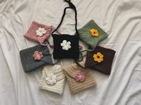 Thank you for visiting my shop! Crochet flower mini bag, handmade by me. This bag has a magnetic clasp for closure. Made to order with the colors shown in the photos or the custom colors of your choice. For custom colors please leave a note with the color combinations of your choice.  Each bag is made to order and takes about 3-5 days to ship out. Care Instructions: Bag can be hand-washed in warm water and laid out flat to dry. Not able to be ironed or dry cleaned.  If you have any questions, fe