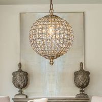 Decor your dining room with elegant scattered light from this crystal globe pendant;Brilliant-cut crystals sit between the lattices in the cage-style shade on this chandelier, delivering maximum refraction and reflection from the glow. Antique goldtone finishing on the strong metal framework adds an extra glam touch;The antique gold frame contrasts the crystals with delicate lattice work that your guests will love it;It only measures 12inch tall;so it can work in space-conscience homes;This fixt