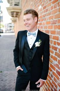 Lighten up the look of the classic black tuxedo with a light blue bow tie. Photography: Mr. and Mrs. Wedding Duo