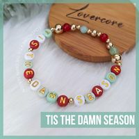 Friendship Bracelet text:  TIS THE DAMN SEASON.  Darn option available.     ✨ All gold spacers are 14k gold plated.  Acrylic beads are hand-buffed to eliminate manufacturer defects. 💖 All bracelets are made to order and will follow the color scheme selected. Bracelets measure approximately 7" unstretched and are made using high-grade elastic cord. Each bracelet is double-strung and secured with adhesive-reinforced knots to minimize the chance of breakage, however do take care to not overstretch. IF you require a size larger or smaller than the standard ~7", please leave a note with your order, I'm happy to accommodate.  Returns are not accepted, however if you have any issues with your order whatsoever, please don't hesitate to reach out so I can make it right. 💕 ABOUT LOVERCORE Handmade