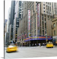 Stretched Canvas Print entitled Radio City Music Hall, Manhattan, New York City.  Radio City Music Hall, Manhattan, New York City, United States of America, North America.  Multiple sizes available.  Primary colors within this image include White, Brown, Hot Pink, Olive Green.  Made in the USA.  All products come with a 365 day workmanship guarantee.  Inks used are latex-based and designed to last.  Canvas is acid-free and 20 millimeters thick.  Canvases have a UVB protection built in to protect against fading and moisture and are designed to last for over 100 years.